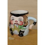 A ROYAL STAFFORDSHIRE CERAMICS BY CLARICE CLIFF NOVELTY MUG