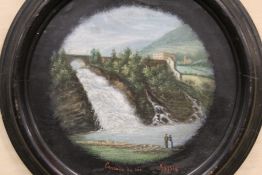 A CIRCULAR FRAMED OIL ON BOARD DEPICTING FIGURES BEFORE A WATERFALL ENTITLED 'CASCOWE DE COO' SPA