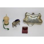 AN ANTIQUE PIN CUSHION, TAPE MEASURE, PURSE, NEEDLE CASE AND AN ELEPHANT PIN CUSHION