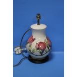 A MOORCROFT HIBISCUS PATTERN LAMP BASE