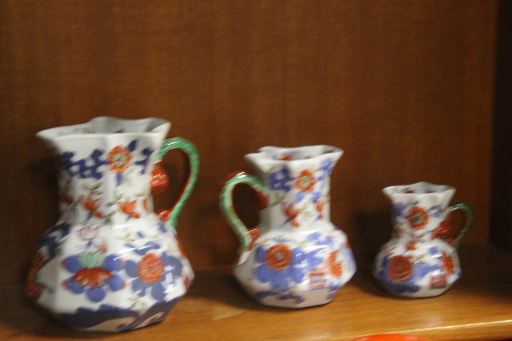 A GRADUATED SET OF FIVE IRONSTONE JUGS¦Condition Report:,/b>The large jug has a hairline crack - Image 3 of 3