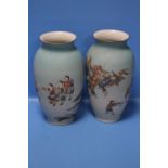 A PAIR OF JAPANESE MEIJI ERA ENAMELLED PORCELAIN VASES BY TAKUCHI CHUBEI, DECORATED WITH FIGURES,