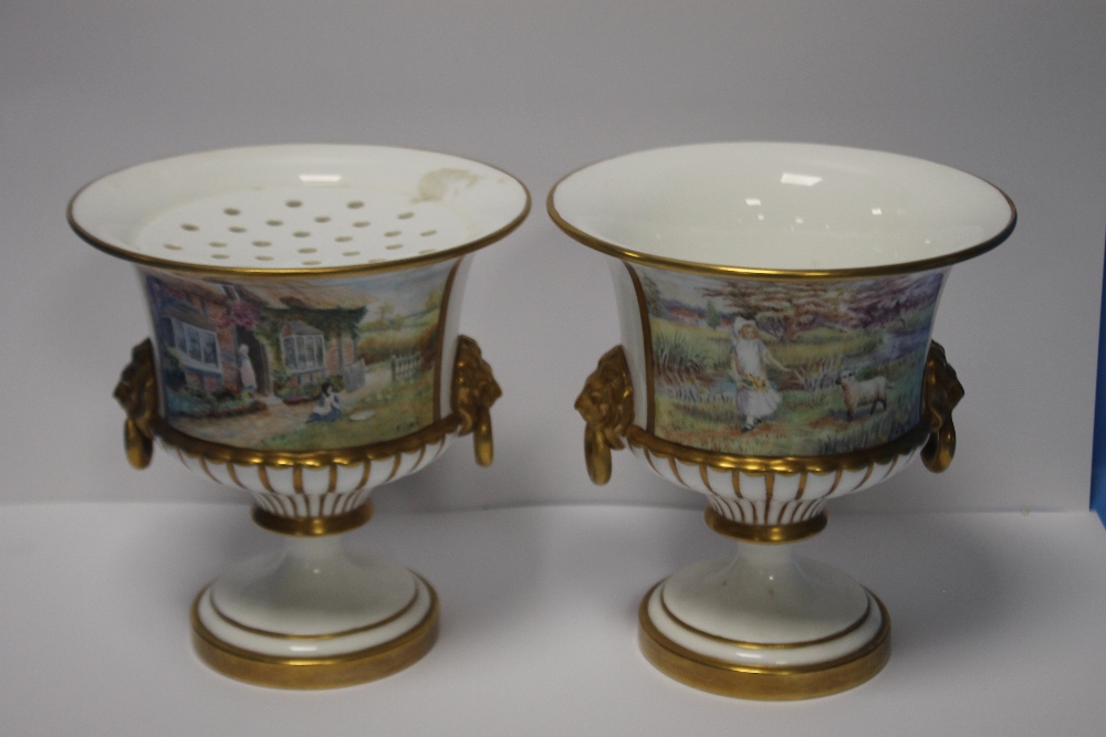 A NEAR PAIR OF HAND PAINTED URNS SIGNED F. CLARK (FRANCIS CLARK WAS A ROYAL WORCESTER ARTIST)¦