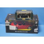 AN AMG BOXED MODEL OF A MERCEDES BENZ AND A MAISTO MODEL OF A JAGUAR 220 (2)