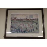 A FRAMED AND GLAZED PICTURE DEPICTING A FOOTBALL MATCH SIGNED B MCMULLEN¦WIDTH: 71CM¦LENGTH: 58CM