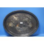 A WHITE METAL OVAL TRAY