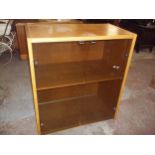 AN OAK TYPE SMOKED GLASS STORAGE DISPLAY CUPBOARD