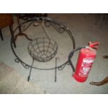 A DECORATIVE WROUGHT IRON GARDEN SWING PLANTER