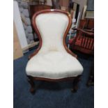 A SMALLER MATCHING MAHOGANY FRAMED UPHOLSTERED LADIES CHAIR