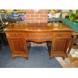 AN ANTIQUE SERVING SIDEBOARD WITH THREE DRAWERS ABOVE TWO CUPBOARDS