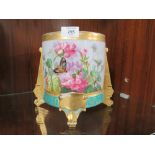 AN ANTIQUE CONTINENTAL STYLE HAND PAINTED PLANTER / FOOTED VASE DECORATED WITH CHERUBS AND