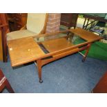 A MID 20TH CENTURY RETRO STYLE WOODEN AND GLASS TOPPED COFFEE TABLE
