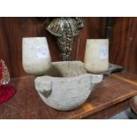 AN ANTIQUE STONEWARE MORTAR TOGETHER WITH TWO PESTLE HEADS