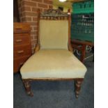 AN EDWARDIAN LADIES / NURSING CHAIR WITH LATER UPHOLSTERY