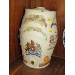 A VINTAGE CERAMIC BARREL WITH IMAGES IN RELIEF, CHIP TO RIM