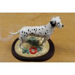 A ROYAL DOULTON FIGURE OF A DALMATIAN ON A PLINTH