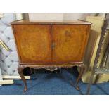 A VINTAGE MAHOGANY AND BURR WALNUT DRINKS CABINET RAISED ON CABRIOLE LEGS WITH FITTED INTERIOR, H
