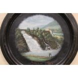 A CIRCULAR FRAMED OIL ON BOARD DEPICTING FIGURES BEFORE A WATERFALL ENTITLED 'CASCOWE DE COO' SPA
