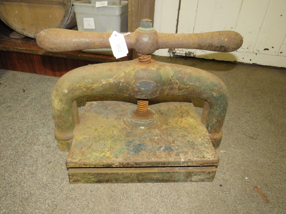 AN ANTIQUE CAST IRON BOOK PRESS