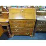 A VINTAGE BURR WALNUT FOUR DRAWER WRITING BUREAU - W 77 CM