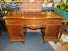 AN ANTIQUE SERVING SIDEBOARD WITH THREE DRAWERS ABOVE TWO CUPBOARDS