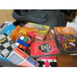 A SMALL TRAY OF GAMES AND PUZZLES ETC., TO INCLUDE A RUBIX CUBE, UNCHECKED