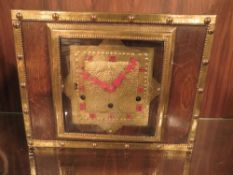 AN OAK AND BRASS ARTS AND CRAFTS STYLE MANTEL CLOCK
