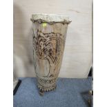 A LARGE TRIBAL SIZE WOODEN FLOOR DRUM WITH TREE DECORATION, HEIGHT 80 CM