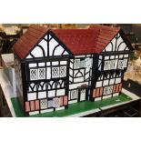 A LARGE HAND BUILT WOODEN DOLLS HOUSE W-91.5CM D-38CM H-57.5CM