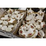 TWO TRAYS OF ROYAL ALBERT OLD COUNTRY ROSES CHINA TO INCLUDE TEA AND COFFEE POTS, DINING PATES, CUPS