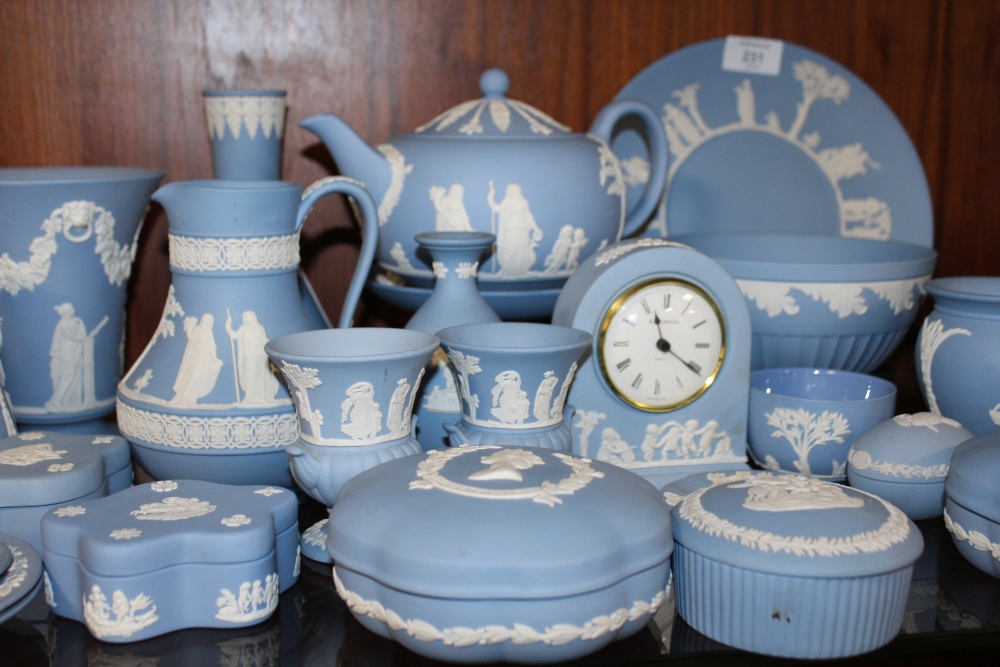 A LARGE QUANTITY OF BLUE WEDGWOOD JASPERWARE TO INCLUDE A TEAPOT, FRUIT BOWL, MANTEL CLOCK ETC. ( - Image 3 of 4