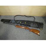 A SERIES 70 MODEL 79 .22 AIR RIFLE WITH SCOPE AND CARRY BAG