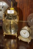 A REPRODUCTION SMITHS MANTEL CLOCK TOGETHER WITH A SWIZA MIGNON METAL MANTEL CLOCK (2)