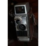 A LEATHER CASED BELL AND HOWELL AUTOSET 2 CAMERA