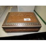 AN EASTERN STYLE MOTHER OF PEARL INLAID TRINKET BOX WITH CARVED PANELS