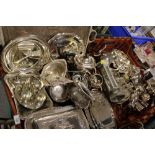 A LARGE QUANTITY OF SILVER PLATED METALWARE TO INCLUDE A TEAPOT, PART CRUET SET, SERVING TRAYS ETC.