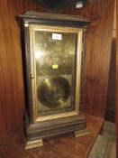 AN UNUSUAL CARVED OAK BRASS FACED MANTEL CLOCK WITH COIN INSERTS TO DIAL, HEIGHT 57 CM