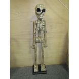 A LARGE WOODEN SKELETON ORNAMENT, HEIGHT 108 CM