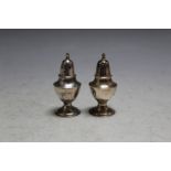 A PAIR OF ANTIQUE SILVER PEPPERS - MARKED STERLING HONG KONG