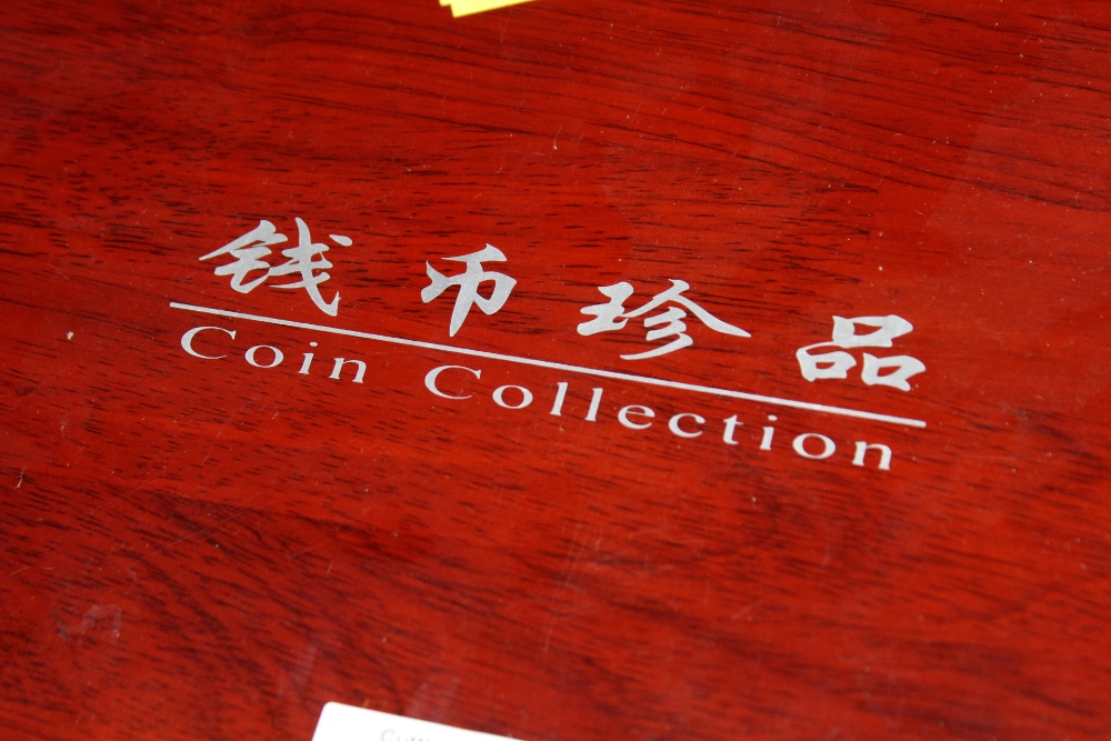 FIVE WOODEN COIN COLLECTION BOXES