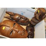THREE MODERN CARVED WOODEN TRIBAL STYLE MASKS, TOGETHER WITH A CARVED WOODEN VASE WITH SNAKE AND
