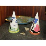 TWO UNMARKED CLARICE CLIFF STYLE SUGAR CASTORS TOGETHER WITH A CARLTON WARE BLEU ROYALE DISH (3)