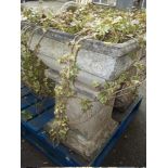 A LARGE HEAVY CONCRETE PLANTER AND PLINTH