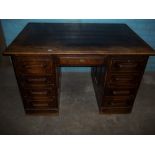 AN ANTIQUE TWIN PEDESTAL DESK