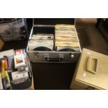 A FLIGHT CASE CONTAINING ABOUT 150 SINGLES RECORDS TO INCLUDE 1970S, 80S, 90S TOGETHER WITH A