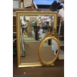 A GILT FRAMED WALL MIRROR TOGETHER WITH ANOTHER