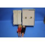 A VINTAGE SINDY WARDROBE, TWO SINDY DOLLS AND A QUANTITY OF BOTH ORIGINAL AND HAND KNITTED CLOTHES