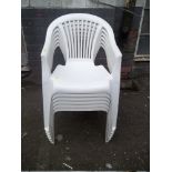 SIX WHITE STACKABLE PLASTIC GARDEN CHAIRS