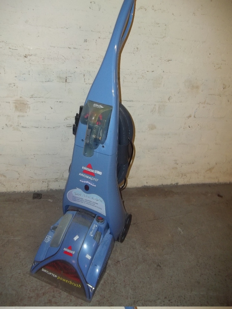 A BISSELL POWERBRUSH CARPET CLEANER