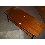 A RETRO TEAK COFFEE TABLE WITH STRETCHER SHELF (SOME WATER DAMAGE)